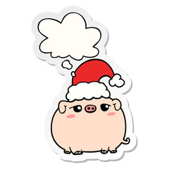 cartoon pig wearing christmas hat and thought bubble as a printed sticker