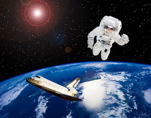 Astronaut above earth and spaceship. The elements of this image furnished by NASA.