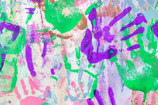 Multicolored hand prints. Colored background from baby hand prints.