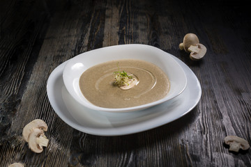 Low key restaurant menu food photo. Delicious fresh dishes in white plate on a dark rustic wooden background