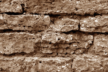 Old grungy brick wall texture in brown tone.