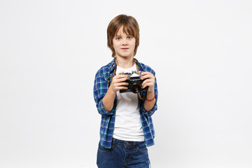 Fun little kid boy in blue t-shirt hold retro vintage photo camera, doing photo shot isolated on white wall background children studio portrait. People childhood lifestyle concept. Mock up copy space.