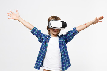 Fun little kid boy in blue t-shirt, headset vr on head watching and play video games isolated on white wall background children studio portrait. People childhood lifestyle concept. Mock up copy space.