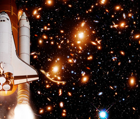 Rocket (shuttle) and galaxy. The elements of this image furnished by NASA.