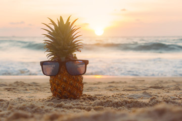 Ripe pineapple on the tropical beach at sunset. Vacation and summer weekends. Outdoor recreation. Vitamins food and summertime. Seashore.