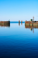 Fototapeta premium Calm blue water and sky scenery of the harbour in Hörnum, Sylt, Germany