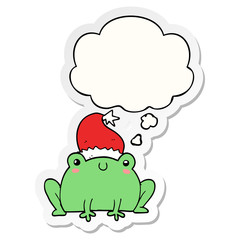 cute cartoon christmas frog and thought bubble as a printed sticker