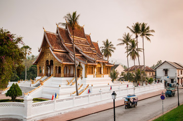 Luang Prabang Royal Palace Museum under coconut tree and morning street