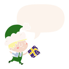 cartoon happy christmas elf and present and speech bubble in retro style
