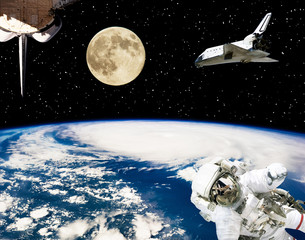 Astronaut, spaceships and moon. Earth on the backdrop. The elements of this image furnished by NASA.