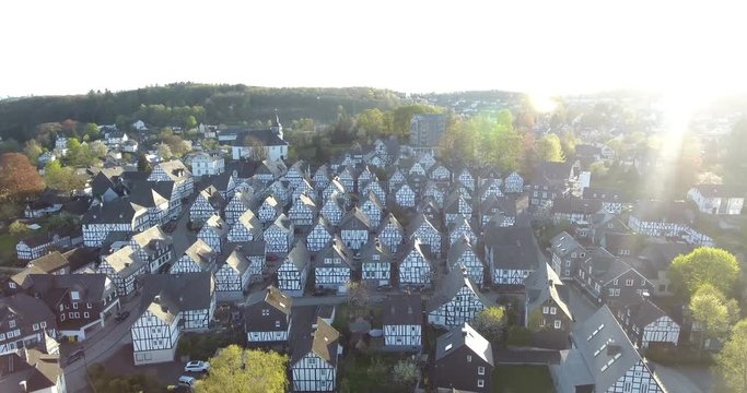 Aerial view, Rural scene with view of small village. Freudenberg Historic Housing. Suburbs seen from above. Copter footage of small town in Europe. 4k