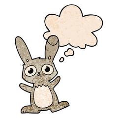 cute cartoon rabbit and thought bubble in grunge texture pattern style