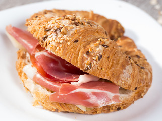 sandwich made with croissant cheese and Parma ham