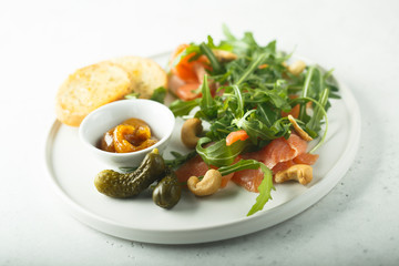 Smoked salmon arugula salad with pickles