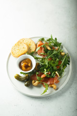 Smoked salmon arugula salad with pickles