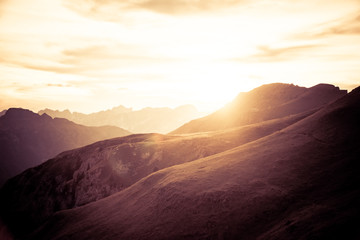 Fototapeta na wymiar layered mountains landscape background of Dolomites, Italy