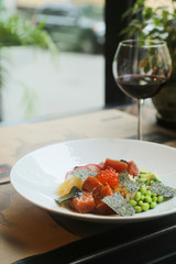 Salmon poke bowl with red caviar