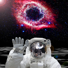 Obraz na płótnie Canvas Astronaut on the alien planet. Beautiful view behind. The elements of this image furnished by NASA.
