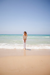 european girl having fun on the sea beach