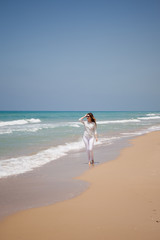 european girl having fun on the sea beach