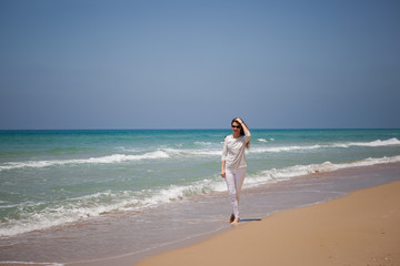 european girl having fun on the sea beach