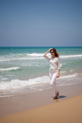 european girl having fun on the sea beach
