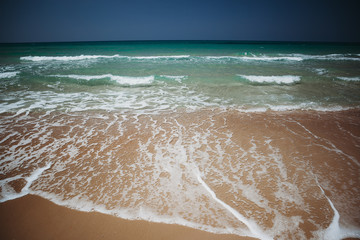 Mediterranean beach with turquoise water in sunny weather