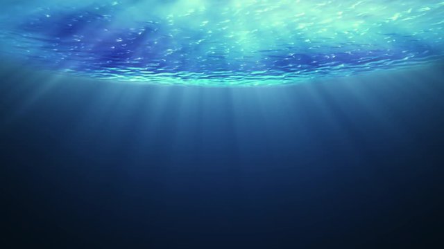 Beautiful underwater sea scene view  and ripples with sun light beams shining from above coming through the deep clear blue water causing a beautiful ocean waves ripple. Seamless loop.