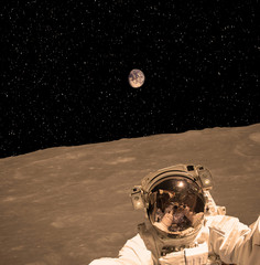 Naklejka premium Astronaut makes selfie on Mars land. The elements of this image furnished by NASA.