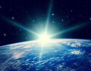 Earth from space during a sunrise. The elements of this image furnished by NASA.