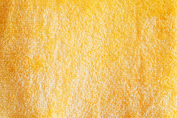 Yellow plush fabric. Background. Texture. Closeup
