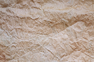 Background of crumpled craft paper. Texture. Closeup. Grange style