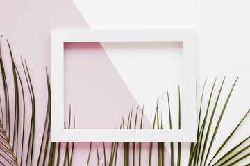 Flat lay of frame with leaves decoration