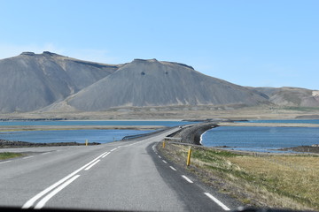 The street with Mountains and a blue lake in Iceland
