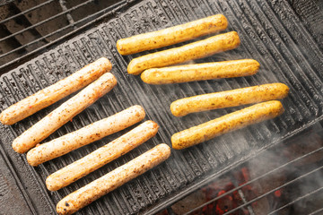 Cooking sausages on the barbecue grill. Grilled sausages