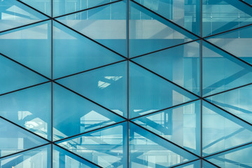 Glass wall with reflections in the office building