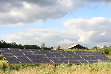Solar panels Photovoltaic cells in the background of the sunset. Solar panels on the roof