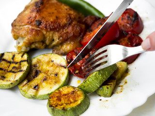 Grilled chicken breasts with vegetables