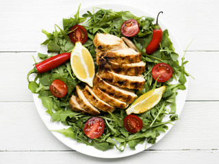 Grilled chicken breasts with vegetables