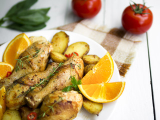 Cooked chicken legs with herbs