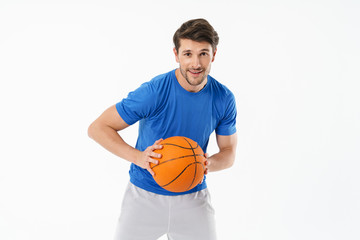 Attractive young fit sportsman wearing t-shirt standing