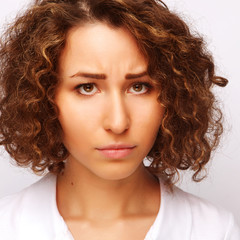 Portrait of dissatisfied young woman, studio portrait