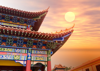chinese buddhist temple in sunset