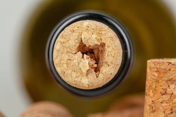 wine bottle with cork on dark background close up view