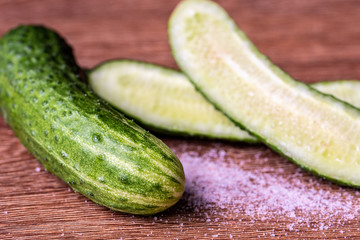 Cucumbers and salt on the table. Close-up. Selective focus.