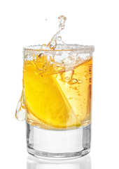 Gold tequila shot  isolated on white background