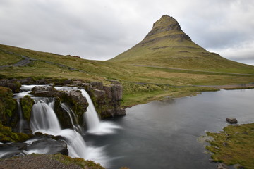 Famous kirkjufell mountain with the kirkjufell falls waterfalls in front in Grundarfjödur in Iceland