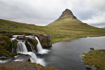 Famous kirkjufell mountain with the kirkjufell falls waterfalls in front in Grundarfjödur in Iceland