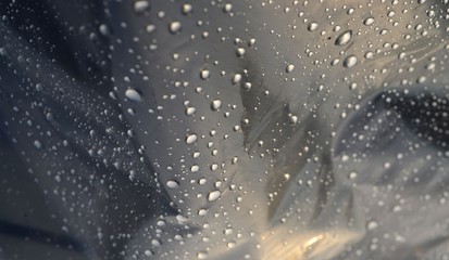 Close up of raindrops on oilcloth