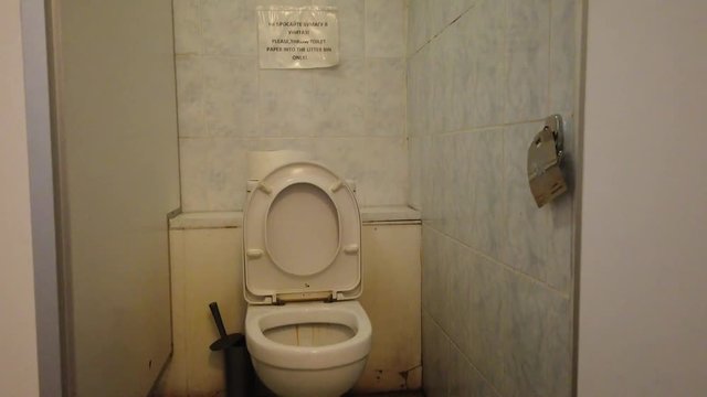 Point of looking men in the toilet. Old dirty public toilet. Tourism concept.